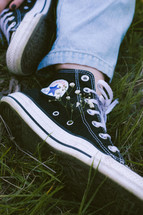 converse sneakers in grass
