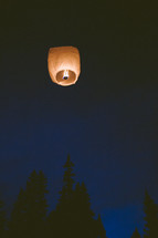 paper lantern in the night sky