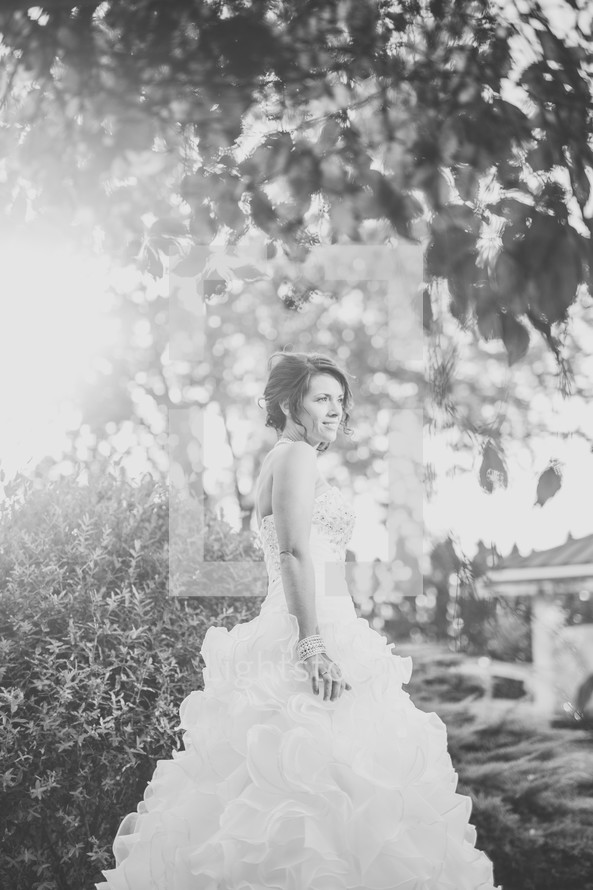 a bride standing outdoors 