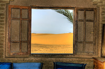 view of the desert through an open window 