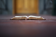 open Bible on a door step 