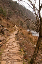 rock path along a river shore