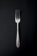 fork on a black background 