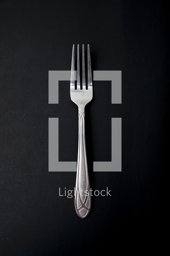 fork on a black background 