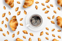Pattern French croissant on a light background with coffee on a white background with a place for text
