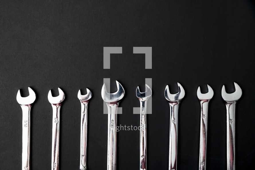wrenches on a black background 
