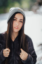 portrait of a young woman in a beanie 