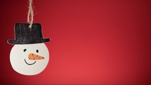 Christmas snowman decoration with red background 