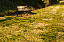 park bench and freshly mowed grass