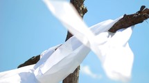 white shroud on a cross