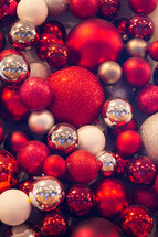 red, white, and silver Christmas ornaments 