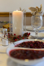 bowl of cranberry sauce on a Thanksgiving table 