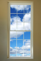 blue sky and clouds out a window 
