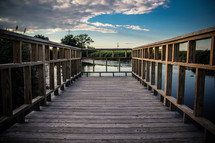 boardwalk dock over a lake 
