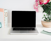 laptop on a home office desk 
