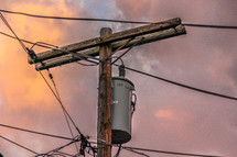 power pole and power lines at sunset 