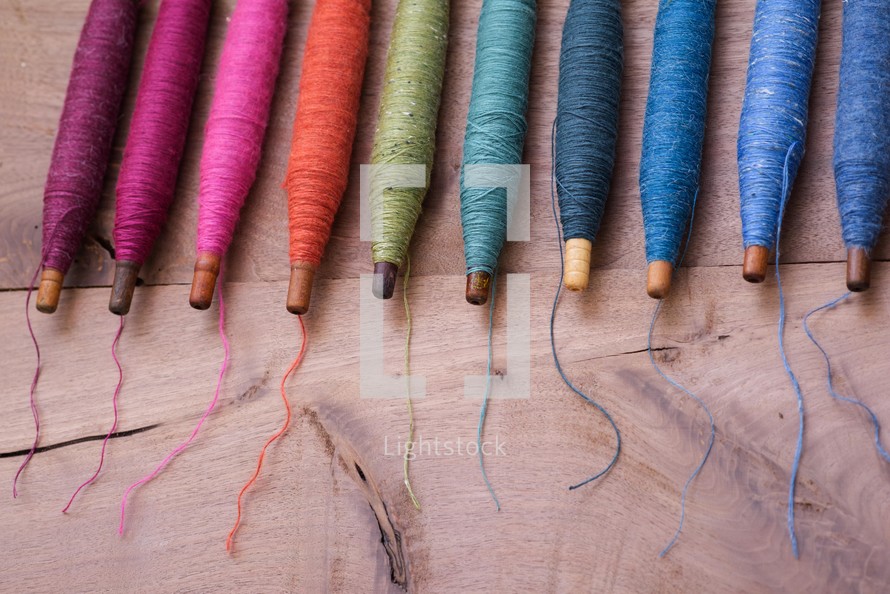 rainbow of spools of thread 