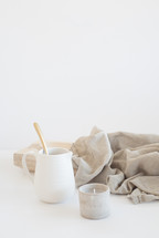 spoon in a pitcher and linen fabric 