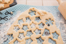 star shaped cookies cutout of dough 
