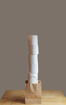 tall stack of toilet paper rolls