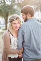 portrait of a couple standing together outdoors 