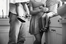 legs of a family in a kitchen 