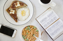 breakfast and morning devotional with open Bible on the table 