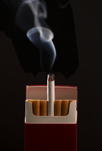 cigarettes against a black background