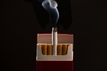 cigarettes against a black background