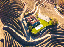 aerial view over terraced hills and house 