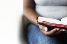 woman reading a Bible in her lap