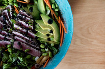 tuna on a bowl of fresh salad 