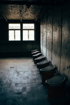 urinals in an abandoned bathroom 