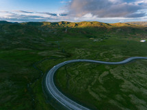 winding highway and green rolling hills 