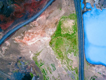 aerial view over highway land and water below 