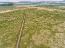 a long stretch of highway on flat land 