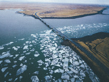 a bridge over an icy lake 