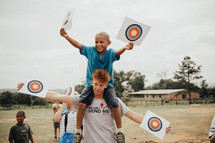 kids holding bullseyes 