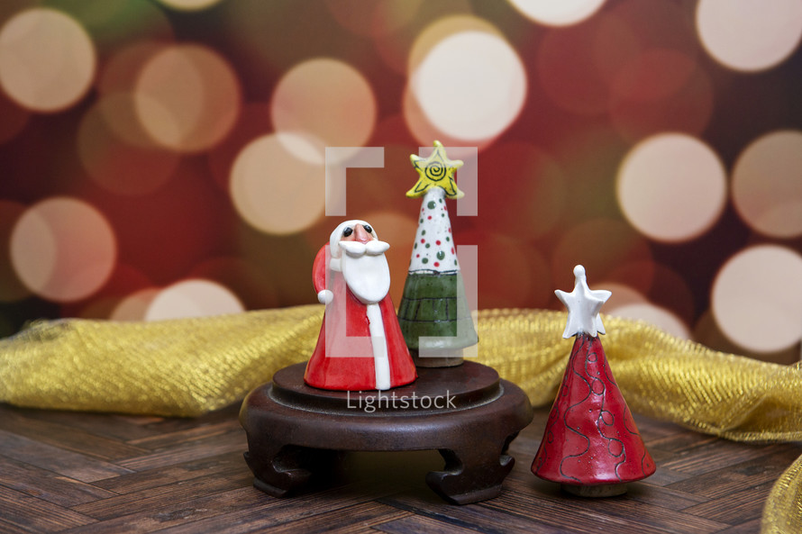 Small clay Christmas decorations with bokeh background