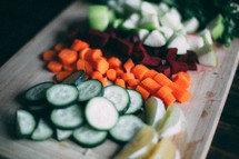 cut vegetables on a wooden tray 