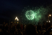 crowds watching fireworks display 