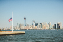 an American flag on a harbor on New York City