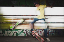 teen boy doing tricks on a skateboard