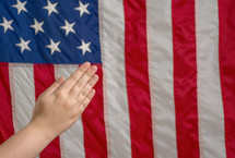 praying hands and American flag 