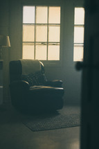 a recliner in a corner 