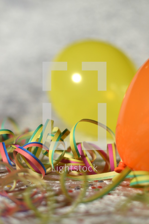confetti, ribbon, and balloons 