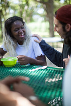 eating soup and conversation at a soup kitchen 