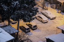 Snowy cars in the night city