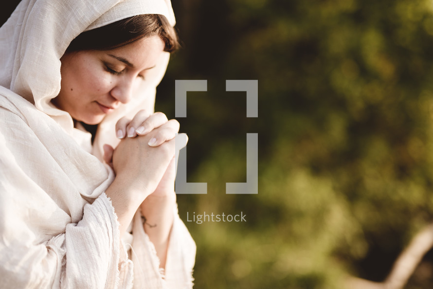 a woman in Biblical times praying 