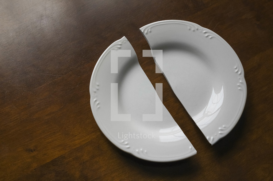 broken plate on a wood background 